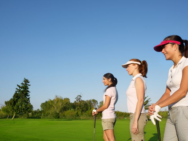Ladies playing golf on the golf course
