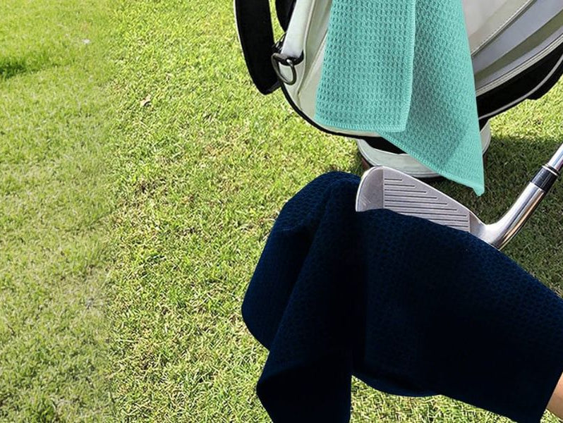 Use a black golf towel to wipe your golf clubs