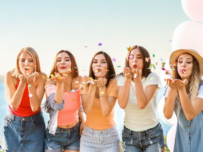 Girls wearing different women's tops
