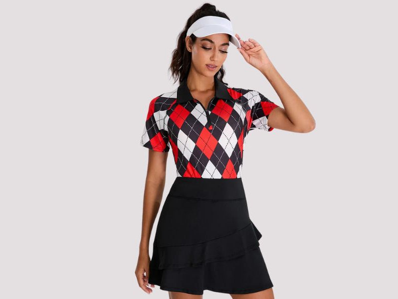The woman wore a short-sleeved black and red checkerboard golf shirt with a black ruffled skirt