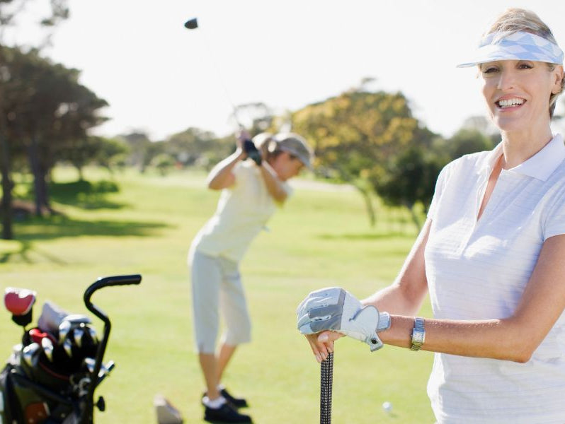 Two ladies playing golf