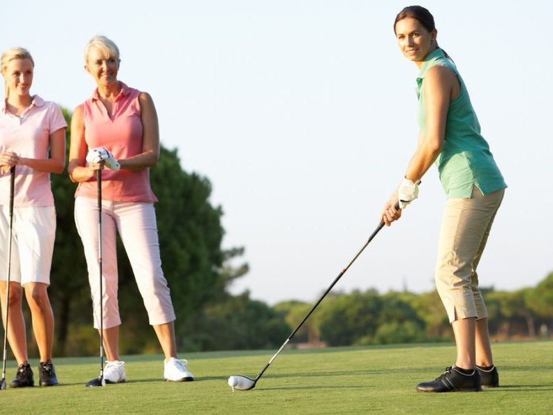 Three ladies playing golf
