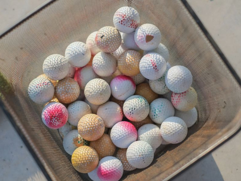 Golf balls in a bucket
