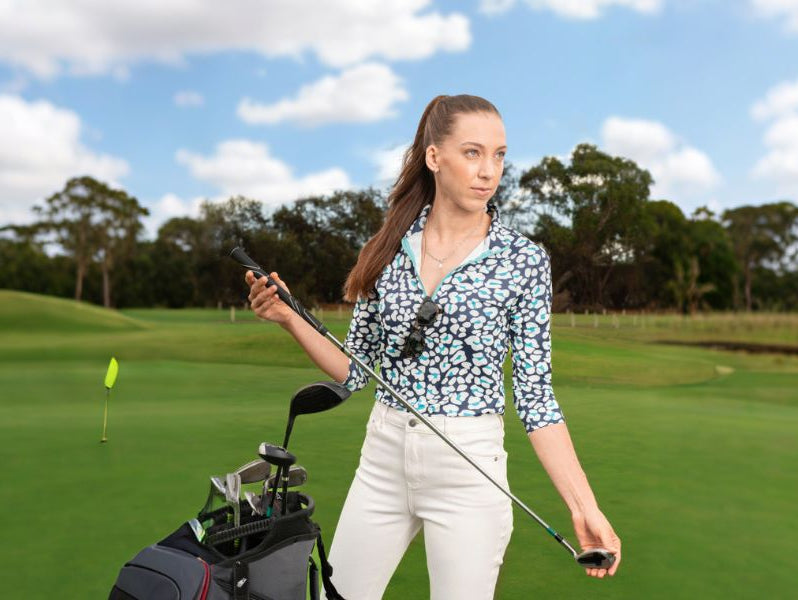 Women wear blue collared polo shirt with white pants
