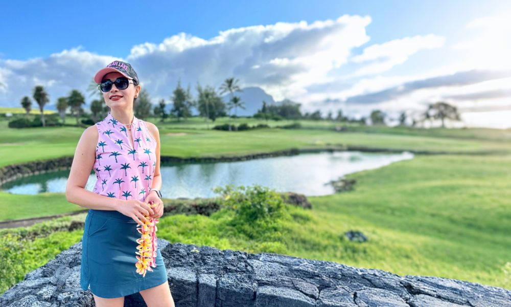 Woman wearing pink sleeveless Hawaiian shirt