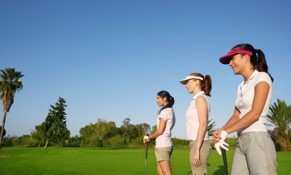 Ladies playing golf on the golf course