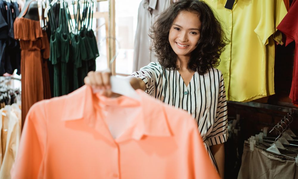 Women choosing shirts and tops