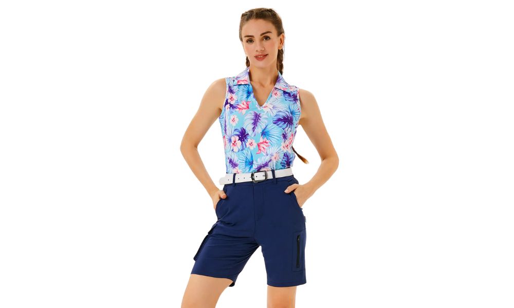 Woman wearing colorful sleeveless printed polo shirt with blue golf shorts