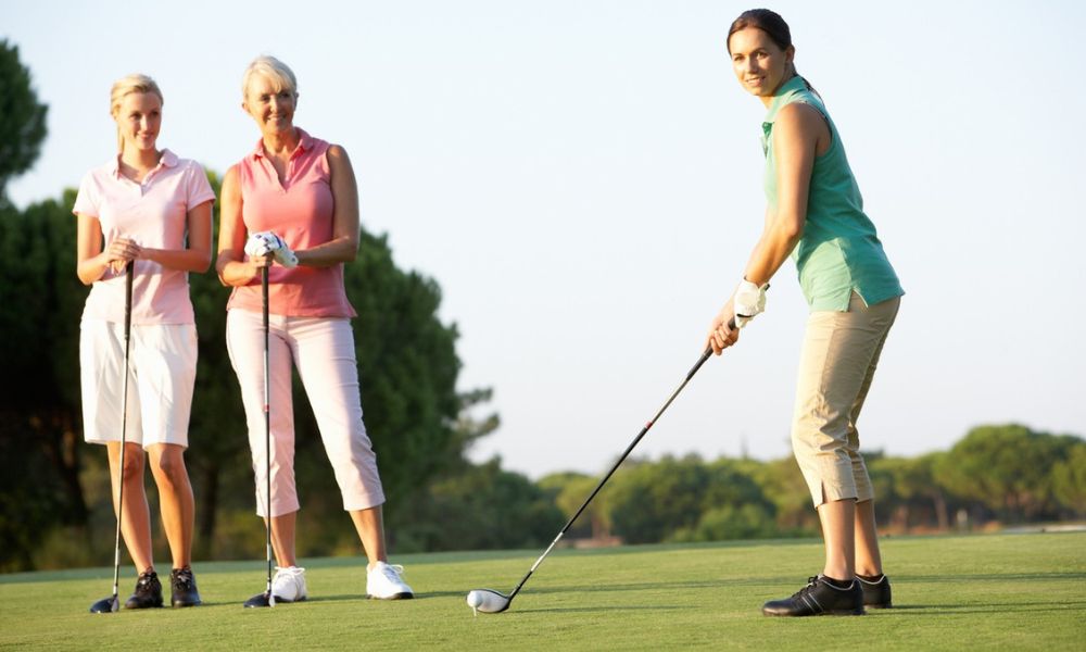 Three ladies playing golf